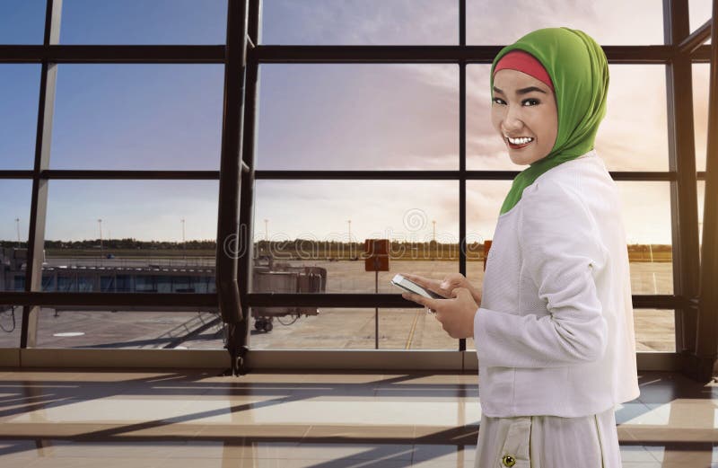 Asian woman muslim holding the phone