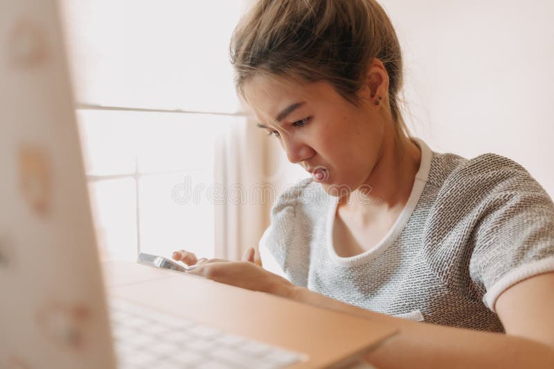 Sad Asian Man Has Bad Online Chat News And Feels Disappointed On The  Smartphone. Stock Photo, Picture and Royalty Free Image. Image 175416709.