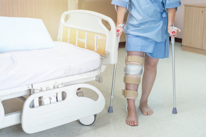 Knee with Knee Brace Support after Surgery with Walking Stick of Patient in  Hospital Stock Photo - Image of male, equipment: 158397764