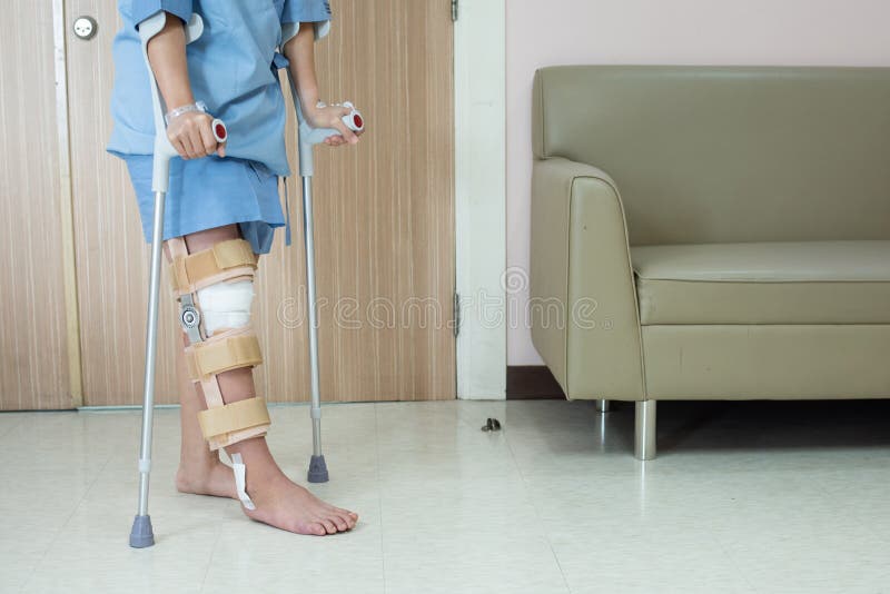 Knee with Knee Brace Support after Surgery with Walking Stick of Patient in  Hospital Stock Photo - Image of male, equipment: 158397764