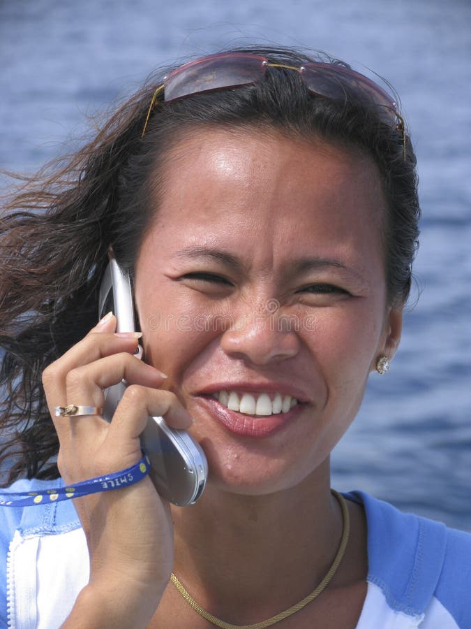 Asian woman on the phone, Philippines. Asian woman on the phone, Philippines