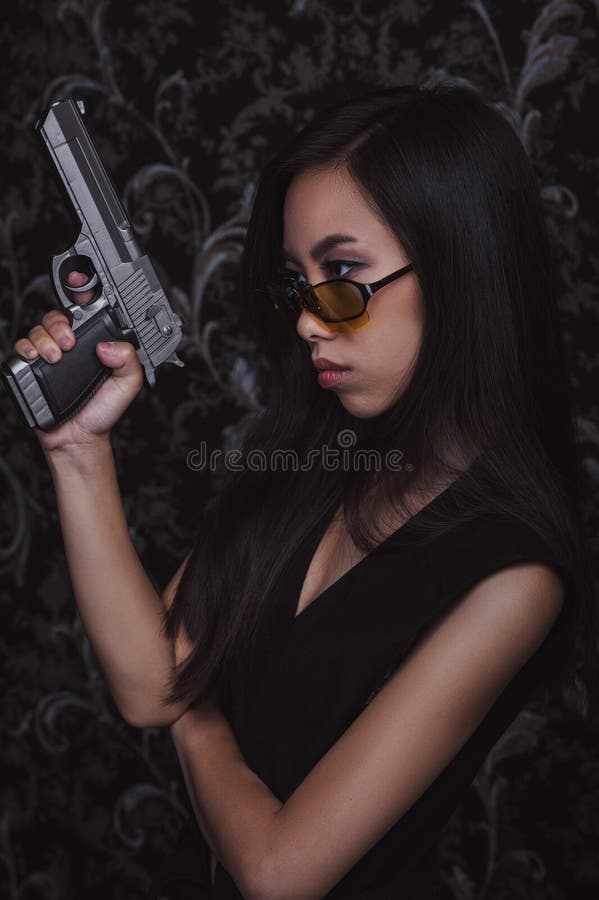 Asian woman with pistols