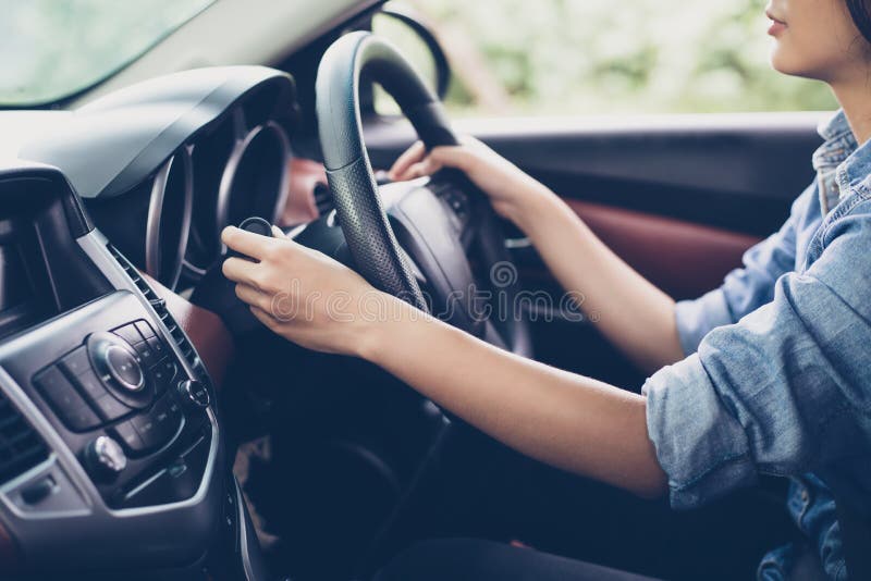 Asian Woman `s hands Push button Turn Signal, button the car,se royalty free stock image Asian Woman `s hands Push button Turn Signal, button the car,se royalty free stock image
