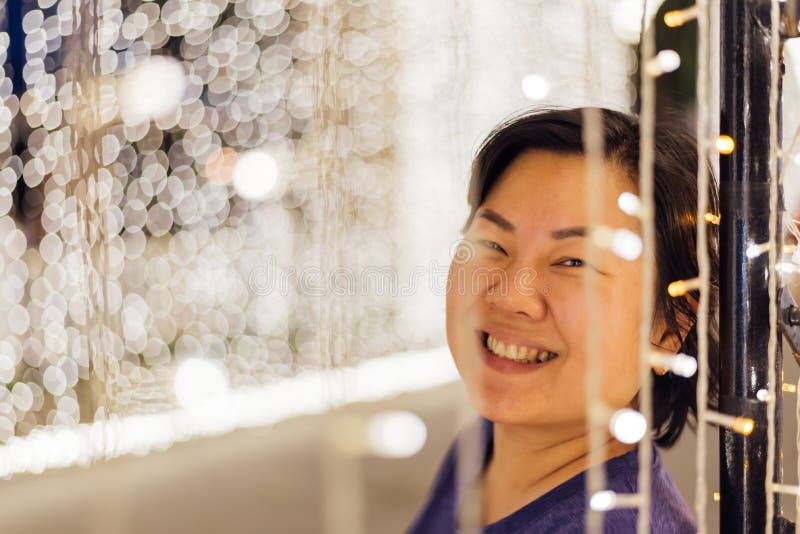Asian woman with bokeh of light for happy new year stock photos