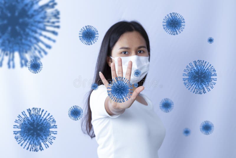 Asian woman show stop hands and wearing mask for virus, prevent the spread of the corona virus or COVID19.