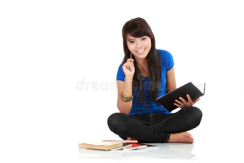 Asian woman sit with a book