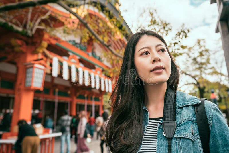 Asian woman standing near famous temple royalty free stock photos