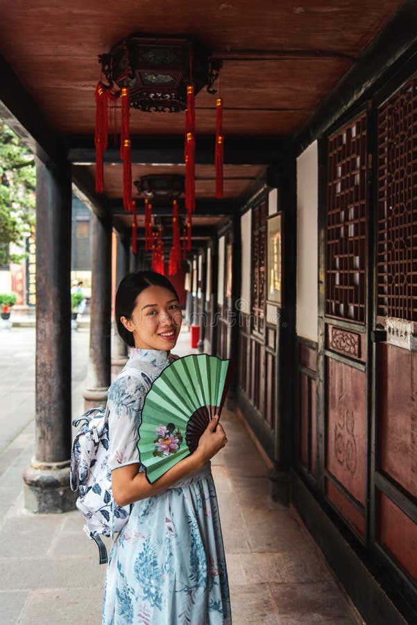 Asian woman in a temple holding a hand fan royalty free stock image Asian woman in a temple holding a hand fan royalty free stock image