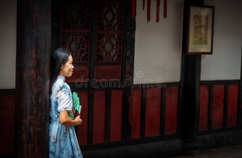 Asian woman in a temple holding a hand fan stock photography Asian woman in a temple holding a hand fan stock photography