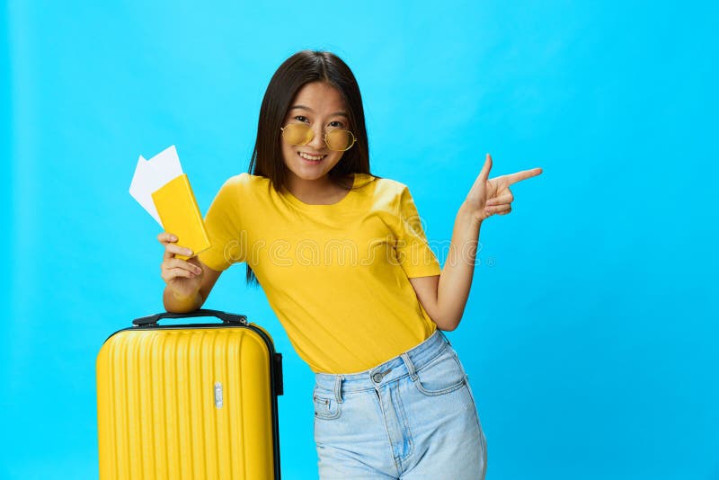 Asian Woman Traveling with Yellow Suitcase and Tickets with Passport in ...