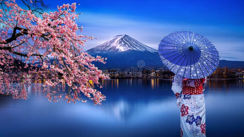 Asian woman wearing japanese traditional kimono at Fuji mountain and cherry blossom, Kawaguchiko lake in Japan royalty free stock images Asian woman wearing japanese traditional kimono at Fuji mountain and cherry blossom, Kawaguchiko lake in Japan royalty free stock images