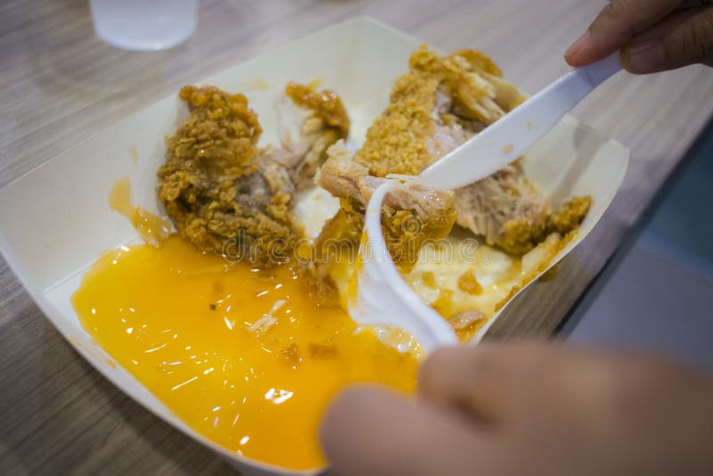Asian women eating fried chicken, focus woman hand hold fried chicken for eat,girl with fast food concept royalty free stock images Asian women eating fried chicken, focus woman hand hold fried chicken for eat,girl with fast food concept royalty free stock images