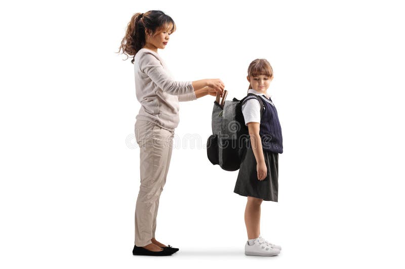 Asian woman helping a girl with school backpack stock images