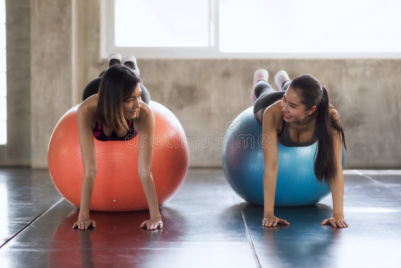 Asian women plank on fitness ball