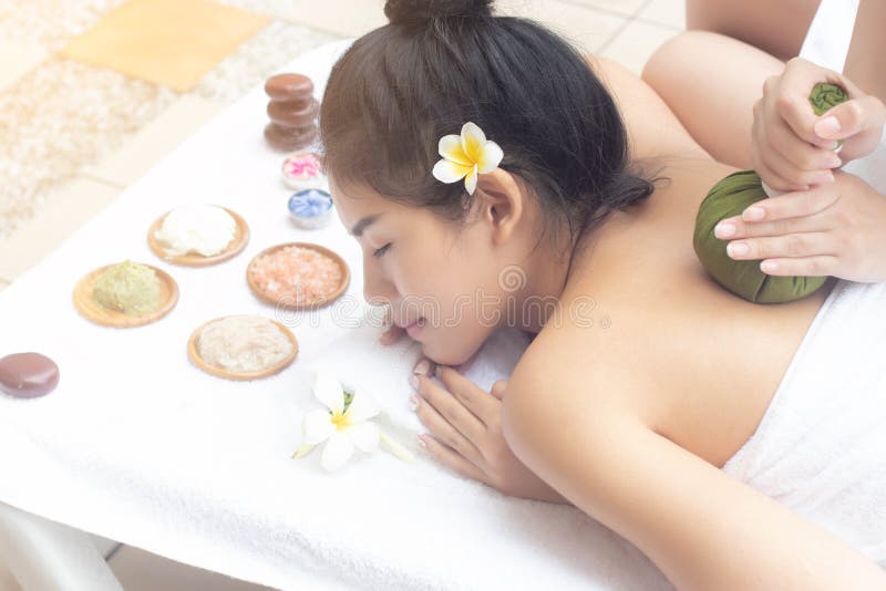 Asian women relaxing massage treatment with joyful mood together at the edge of swimming pool.Wellness body care and spa stock image Asian women relaxing massage treatment with joyful mood together at the edge of swimming pool.Wellness body care and spa stock image
