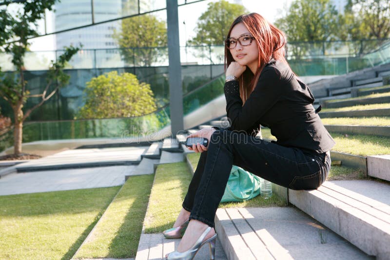 Asian women sitting on stair