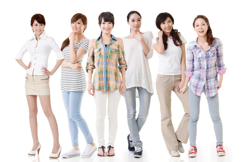 Young asian beautiful women posing for the camera. Full length portrait. Isolated on the white background. Young asian beautiful women posing for the camera. Full length portrait. Isolated on the white background.