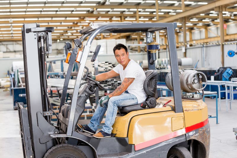 Asian worker in production plant on the factory floor stock photo Asian worker in production plant on the factory floor stock photo