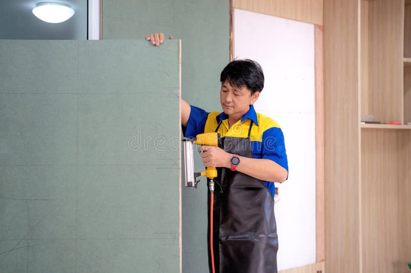 Asian worker and staff of home builder company under working and renovate build-in furniture royalty free stock photos Asian worker and staff of home builder company under working and renovate build-in furniture royalty free stock photos