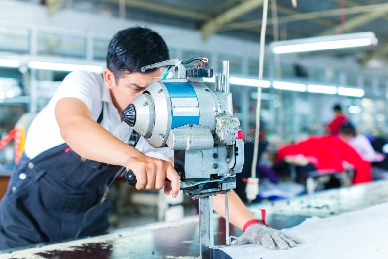Download Asian Worker Using A Machine In A Factory Stock Photo - Image of occupation, asians: 35911630
