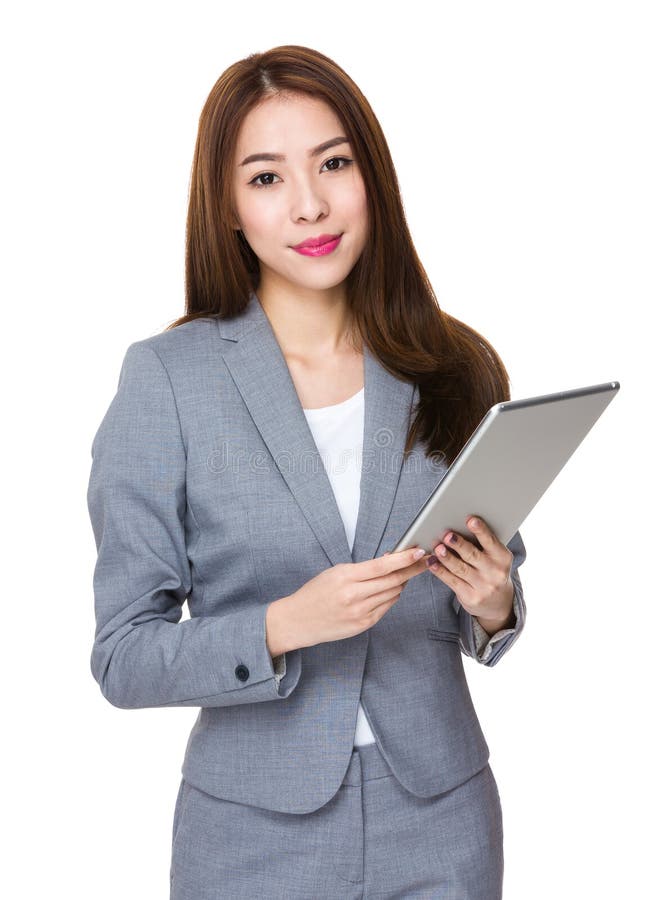 Asian Young Businesswoman use of the tablet pc royalty free stock images Asian Young Businesswoman use of the tablet pc royalty free stock images