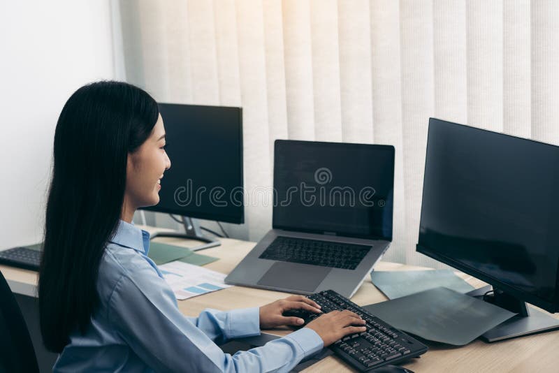 Asian young female programmer working developer programing on a computer code at office royalty free stock images