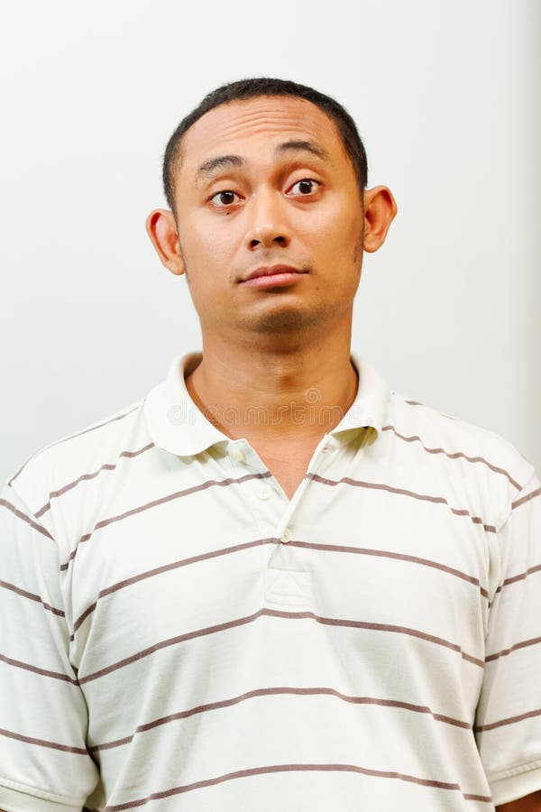 Asian young man with questioning face expression royalty free stock images Asian young man with questioning face expression royalty free stock images