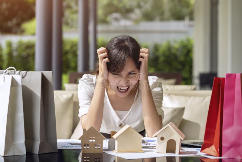 Asian young woman stressed and worry payment expense for online shopping, represent sale homes real estate purchase stock photography Asian young woman stressed and worry payment expense for online shopping, represent sale homes real estate purchase stock photography