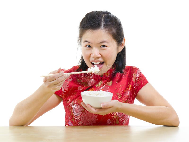 Asiatische Frau, die Reis isst lizenzfreie stockfotografie Asiatische Frau, die Reis isst lizenzfreie stockfotografie
