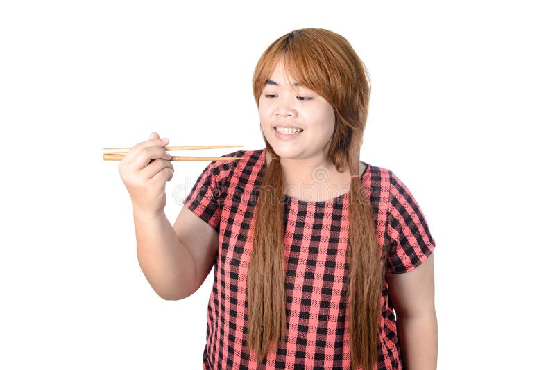 Asiatische pralle Frau, welche die Essstäbchen, lokalisiert auf weißem backgrou hält lizenzfreie stockfotos Asiatische pralle Frau, welche die Essstäbchen, lokalisiert auf weißem backgrou hält lizenzfreie stockfotos