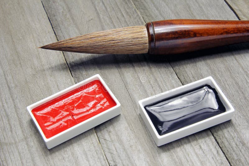 Asiatische Schreibensbürste und -tinte für Kalligraphie stockbild