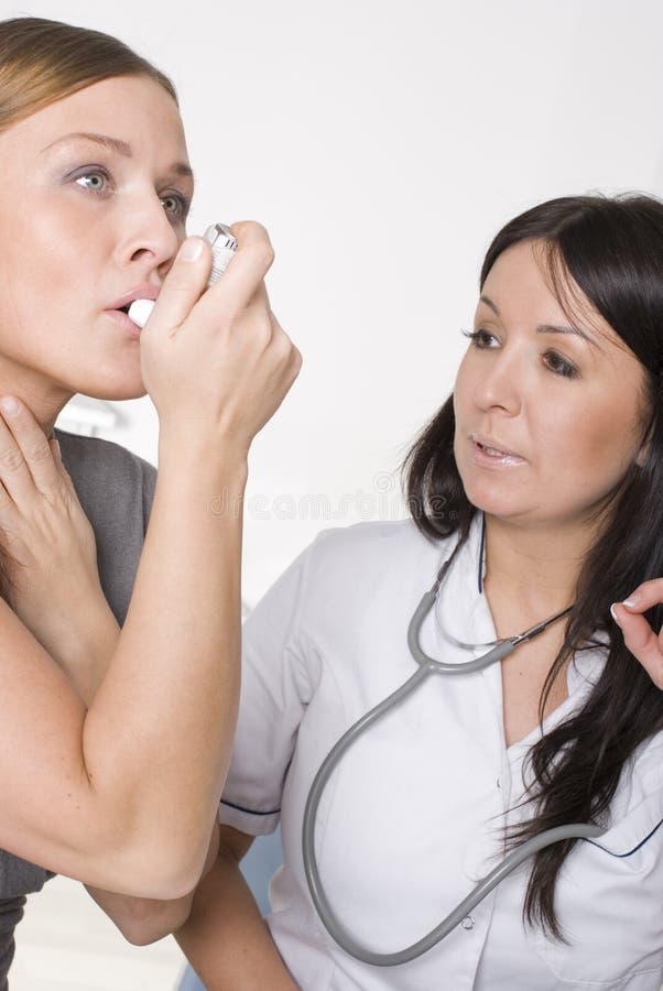 Woman with asthma using inhaler. Woman with asthma using inhaler