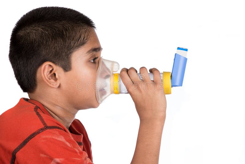 Close up image of a cute little boy using inhaler for asthma. White background. Close up image of a cute little boy using inhaler for asthma. White background