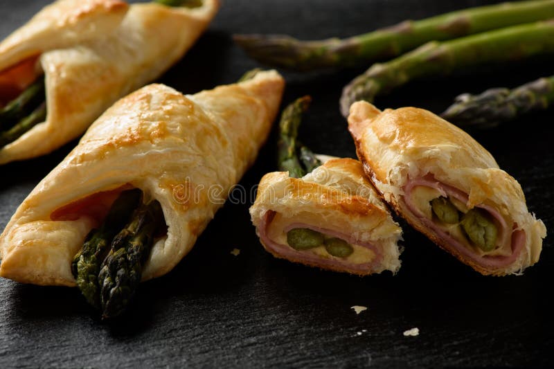 Asparagus Baked in Puff Pastry with Ham and Cheese. Stock Photo Image