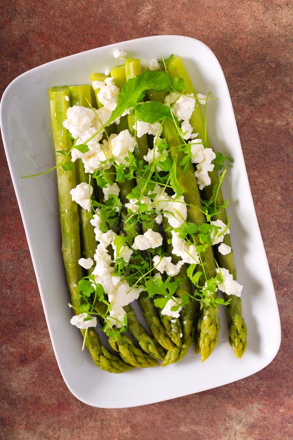 Asparagus with feta cheese stock image. Image of feta 221068489
