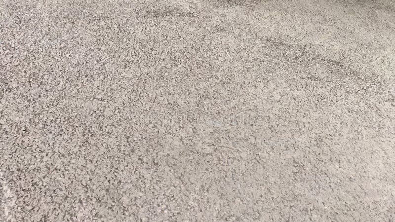 Asphalt as texture, background and place for text. Gravel texture for background