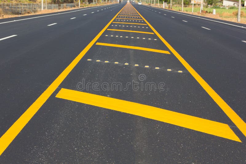 Asphalt road as abstract background, yellow line on the road texture royalty free stock images