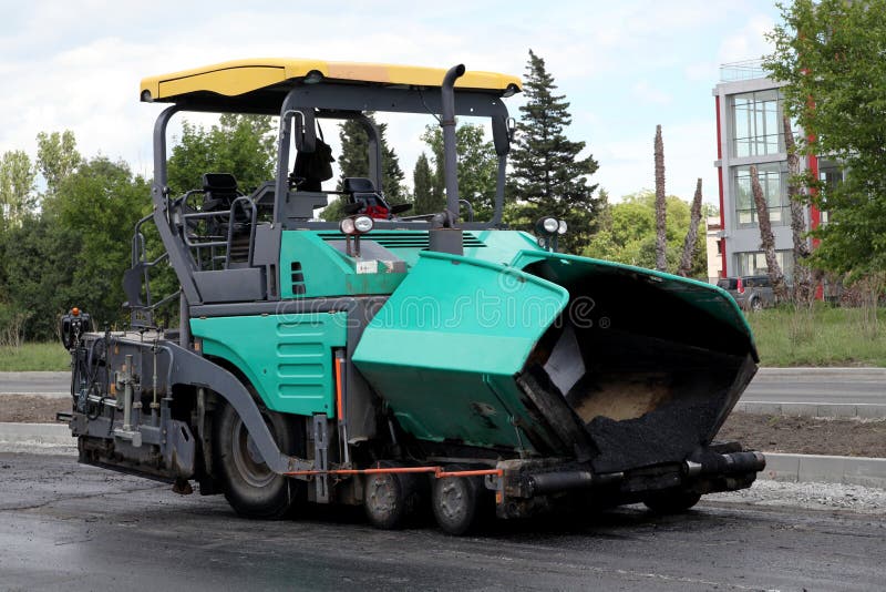 Asphalt spreading machine. Road paving