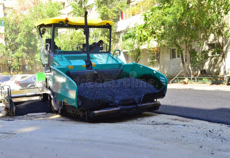 Asphalt spreading machine. Road paving