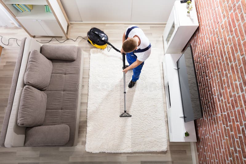 Aspirapolvere di Cleaning Carpet With del portiere