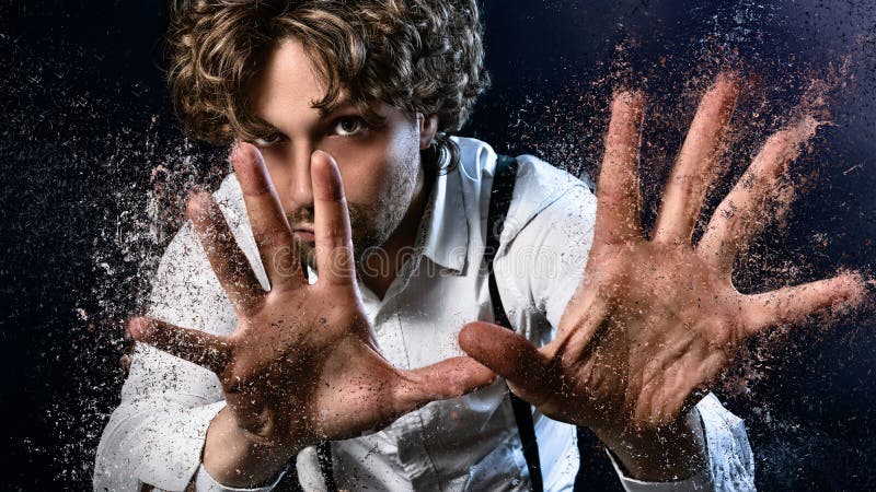 Image of a man who performs magic with his hands. Image of a man who performs magic with his hands