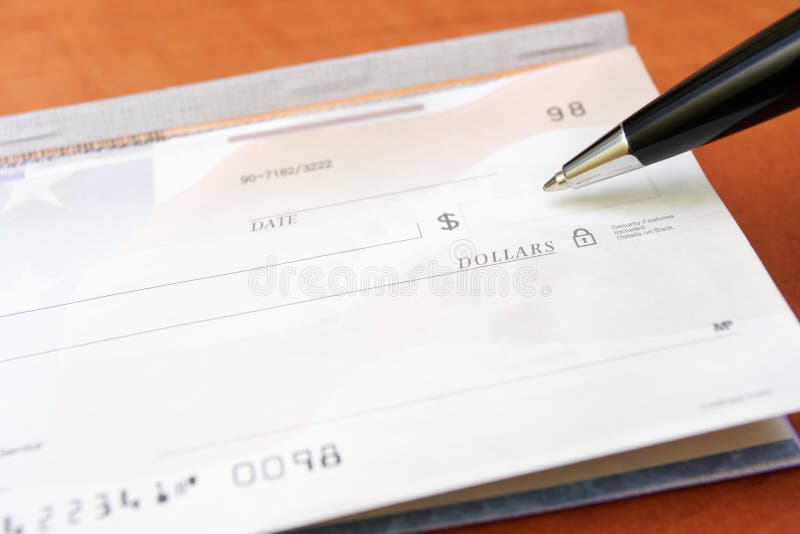 Controllo del concetto finanziario e penna fotografia stock