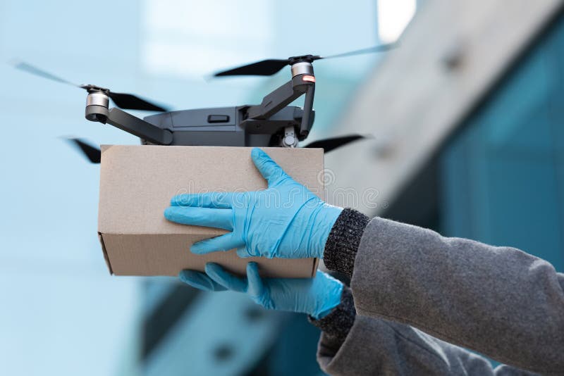 Drone Quadcopter Delivering a Package and Hands Receiving the Parcel