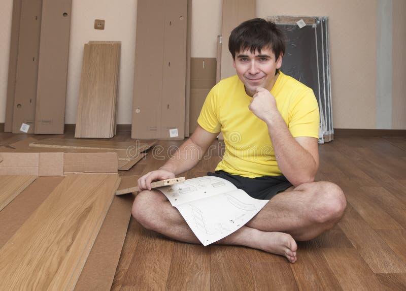 Assembling furniture stock image. Image of house, male 49916439