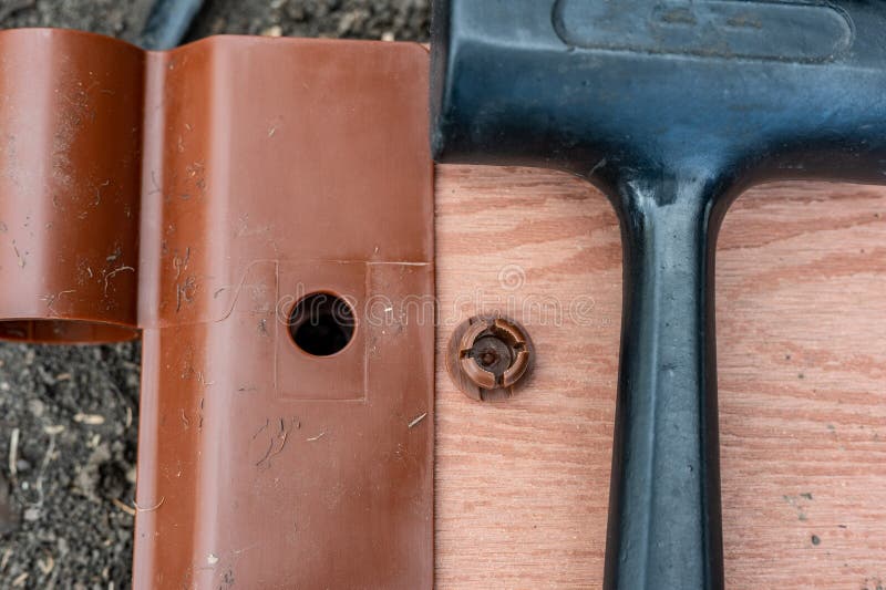 Assembling a Raised Bed Garden Panel with Plastic Connectors Using a