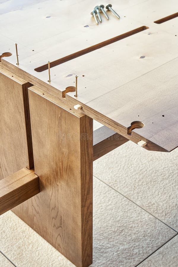Assembling of Wooden Dining Table with Worktop Connectors Stock Image