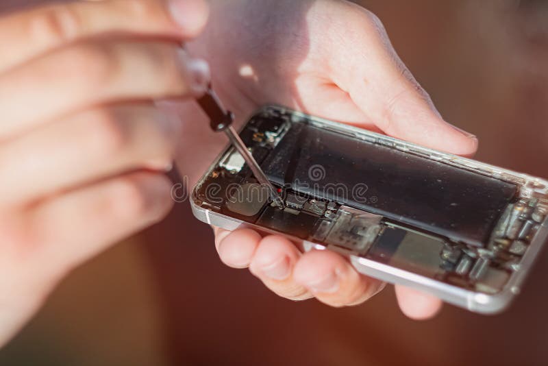 Assembly and disassembly of a broken smartphone, replacement of components at home. stock photos