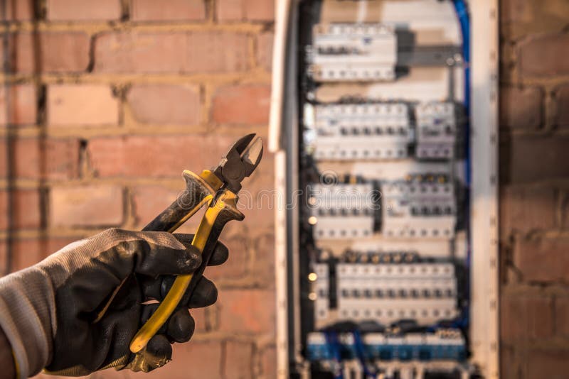 The Assembly of the Electrical Panel, Electrician Job, a Robot with