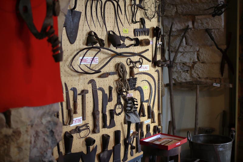 Assisi, Italy - 11/30/2019: Ancient tools in a museum royalty free stock image Assisi, Italy - 11/30/2019: Ancient tools in a museum royalty free stock image