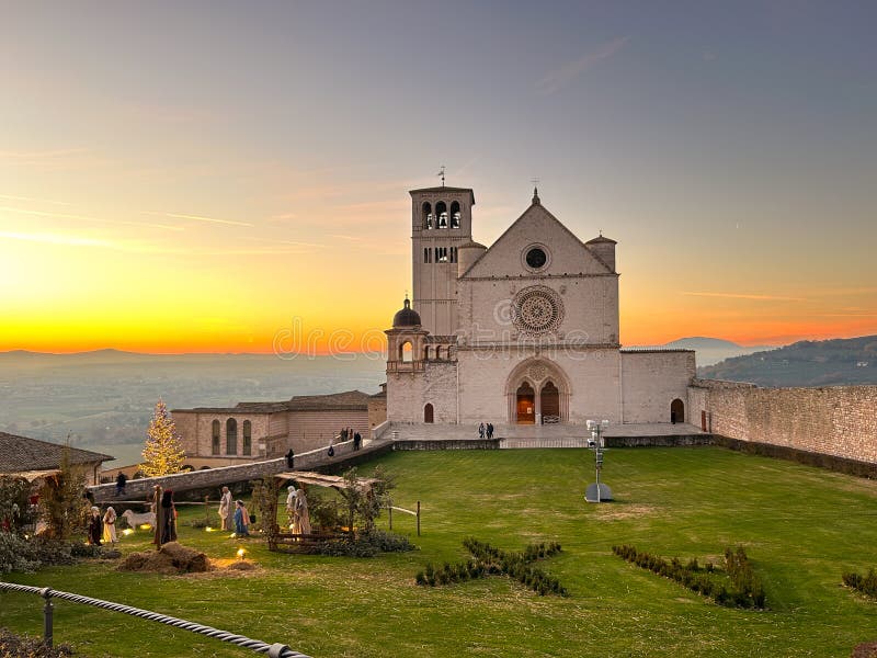 ASSISI, ITALY - DECEMBER 18, 2023: Assisi, San Francesco or Saint Francis Basilica upper church at sunset